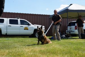 UHP K9 Hasso is held by Trooper Mackelprang