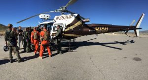 Pilots and tactical flight officers participate in hoist training with the DPS helicopter