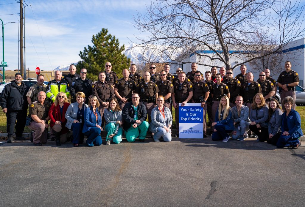 Troopers, local law enforcement, driver education teachers and nurses and doctors from Intermountain Healthcare pose for a group photo.