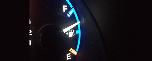 Close up of a fuel gauge in a car.