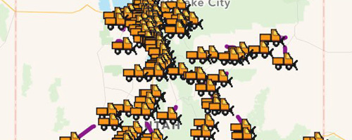 Screen cap from UDOT website that tracks where snow plows are. Image shows animated snow plows on a map.